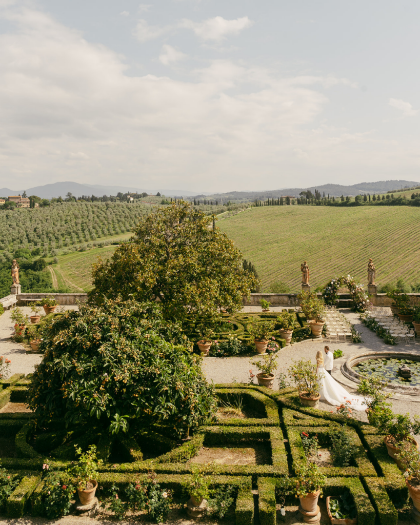 Villa Corsini Florence garden view with formal hedges, terrace, and rolling Tuscany countryside beyond