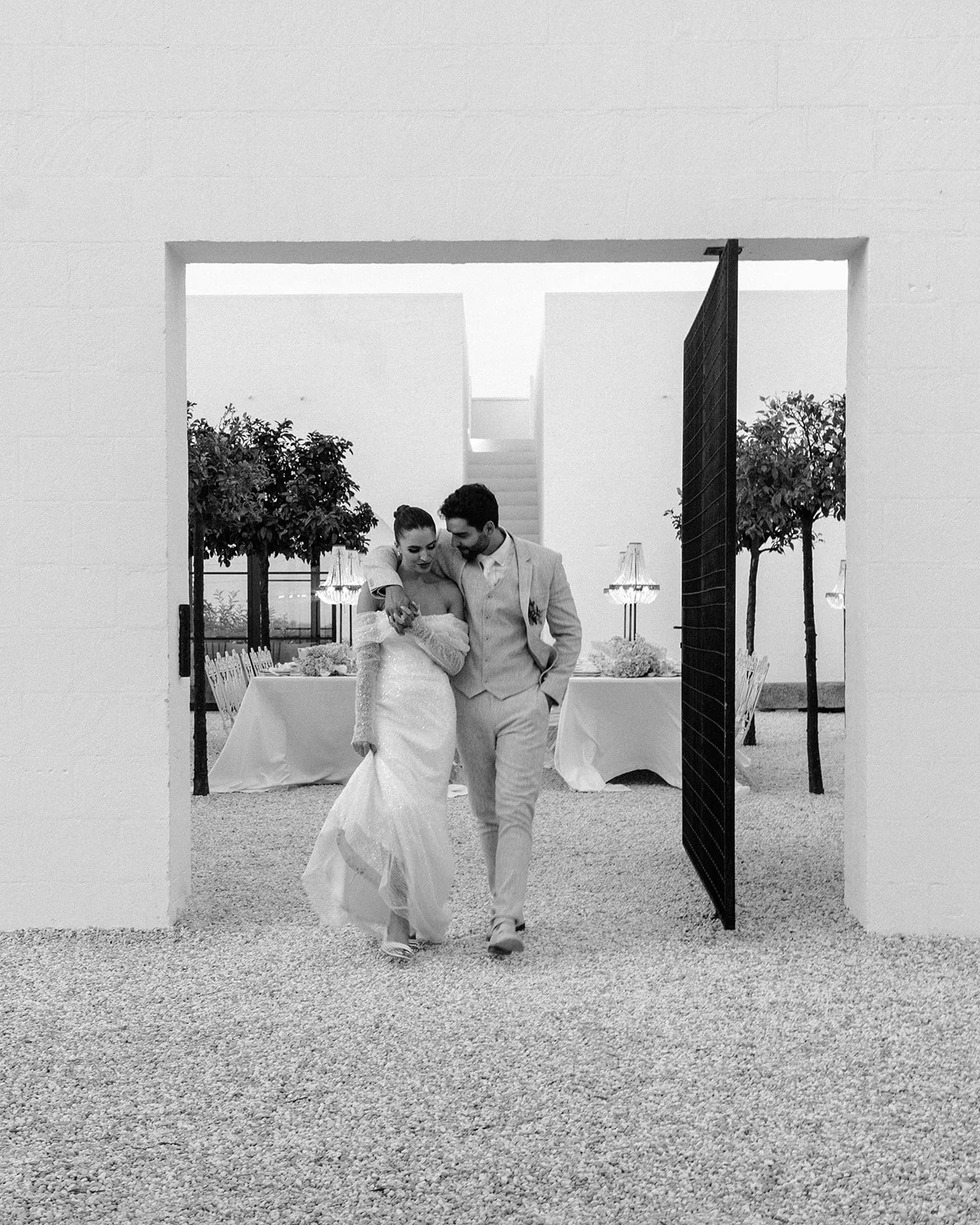 Couple walking outside dinner reception area at Masseria Moroseta