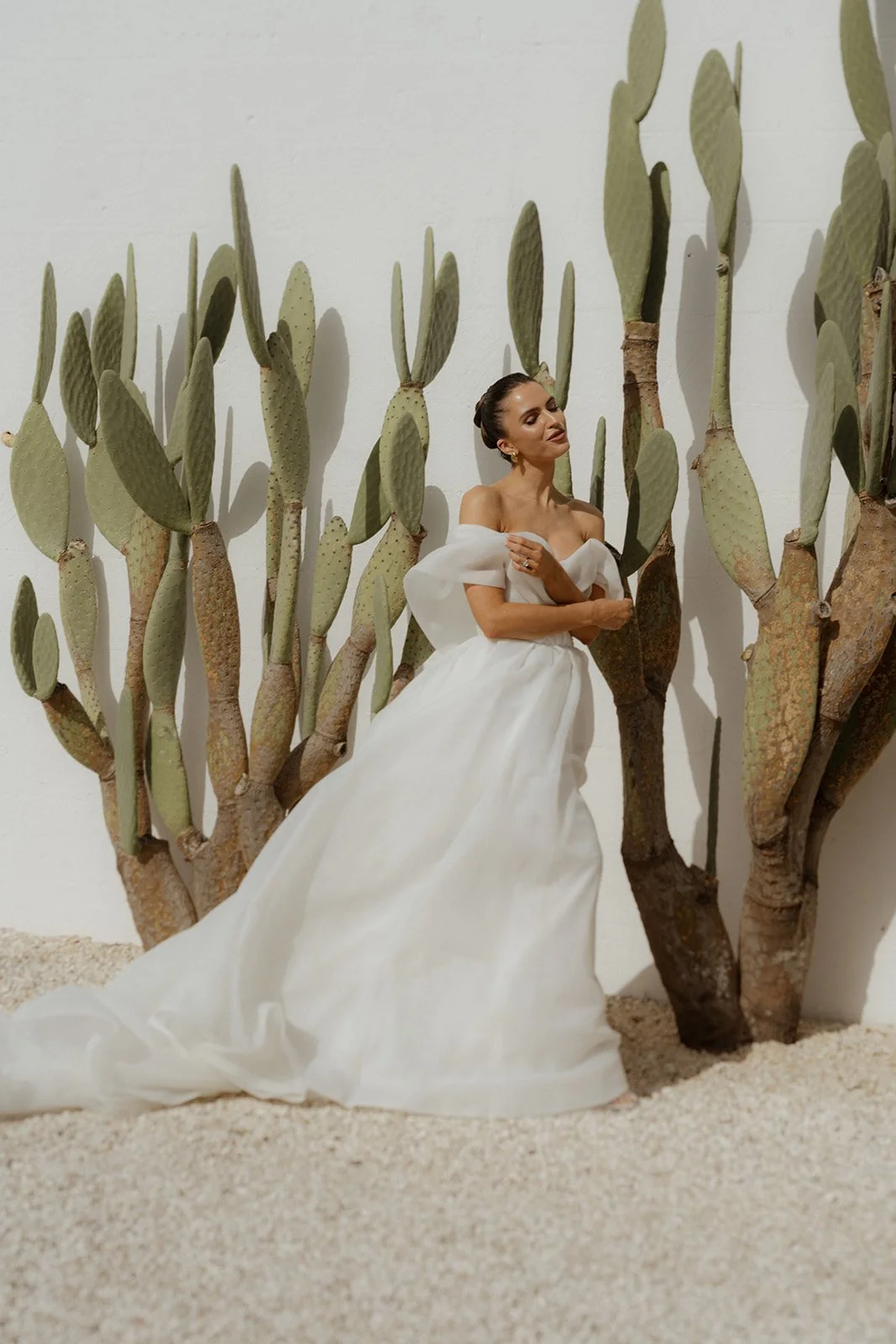 Bridal portrait highlighting modern Eva Lendel Gown and Modern architecture at Masseria Moroseta