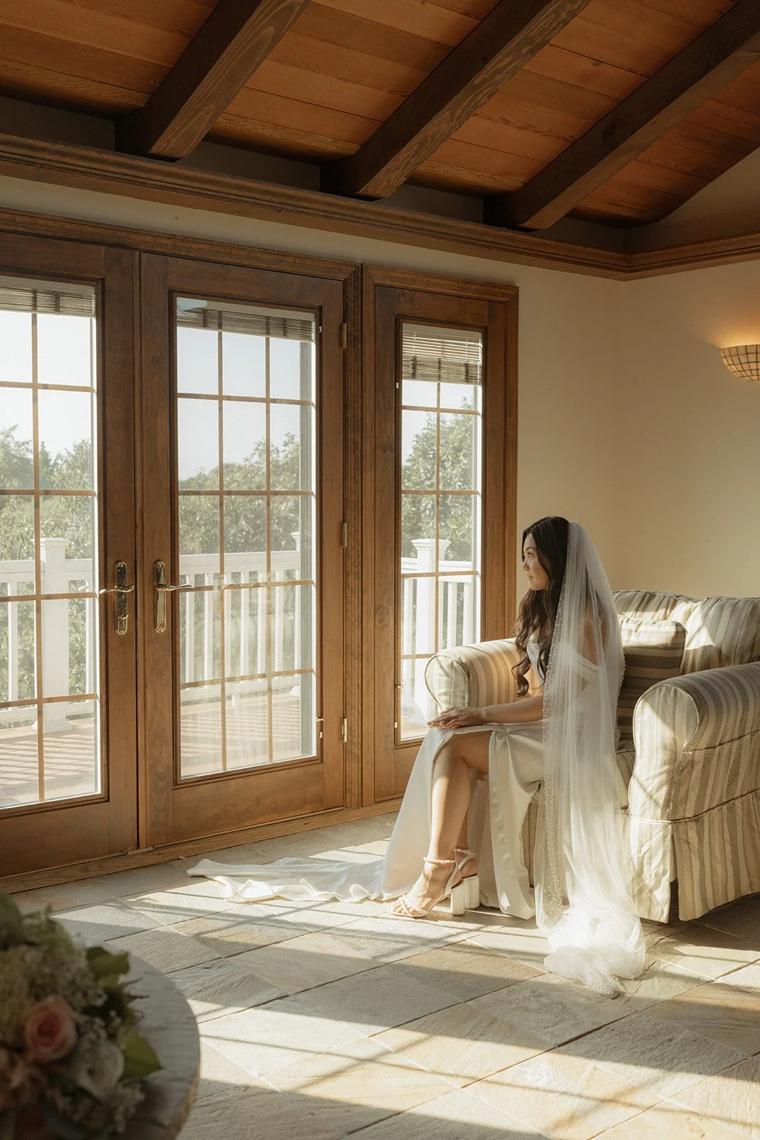   Large windows that allow ample natural light are essential for capturing beautiful, well-lit getting-ready portraits of the bride and groom. This often-overlooked detail creates soft, natural illumination that enhances skin tones and adds depth to the images, bringing out textures and details in an organic, timeless way. A well-lit space ensures a refined, elevated look without relying on harsh artificial lighting.  