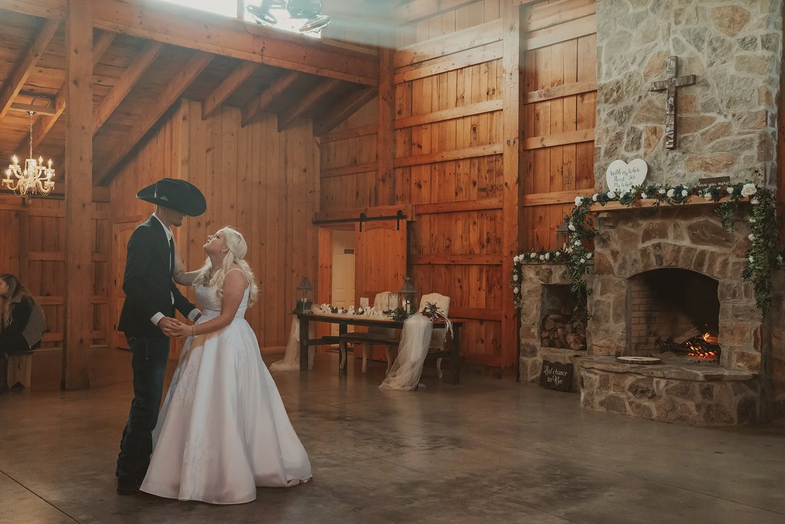   Unlike historic venues and castles with grand architecture and elegant lighting, barns typically have dark wood interiors that absorb light, creating flat and muddy tones rather than a refined, artful atmosphere.    This image required significant adjustments due to the unpredictable lighting in this barn. In contrast, historic venues and castles offer beautiful, naturally flattering light that enhances the overall feel of the photographs.   Because of these challenges, I now focus exclusively on venues that provide the best lighting and atmosphere to create elegant, artful imagery.  