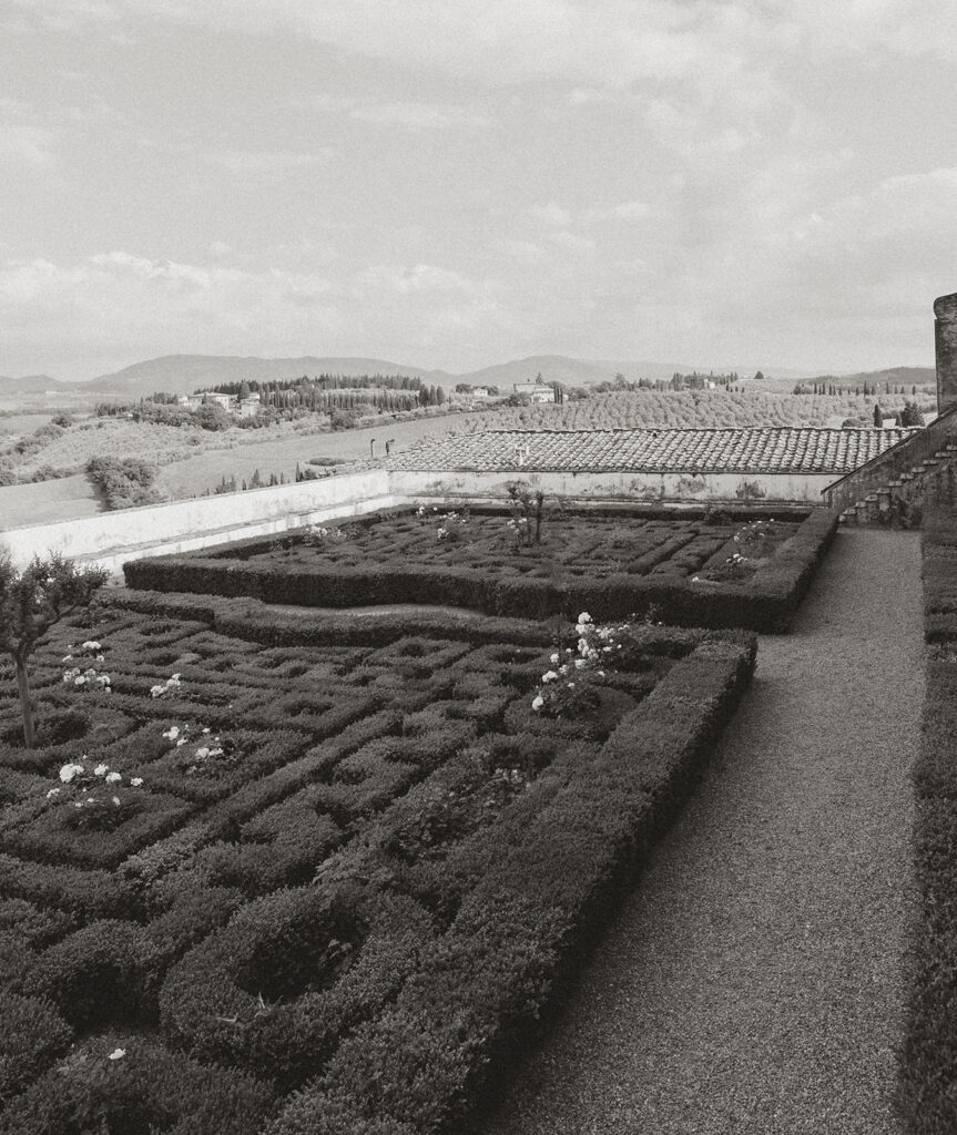 A Tuscany Wedding Styled at Villa Corsini: Timeless Editorial Inspiration in Italy Black and white view of the formal gardens and Tuscan landscape surrounding Villa Corsini in Florence, Italy during an editorial wedding weekend.