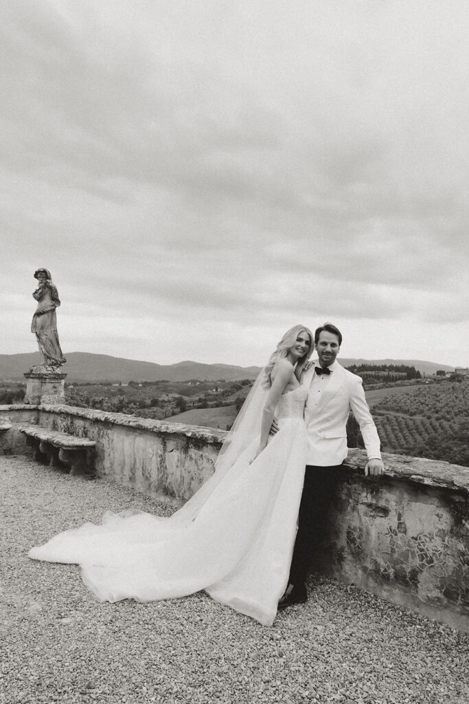 A Tuscany Wedding Styled at Villa Corsini: Timeless Editorial Inspiration in Italy Bride and groom overlooking the Tuscan countryside at Villa Corsini in Florence, Italy during an editorial black and white wedding portrait session.