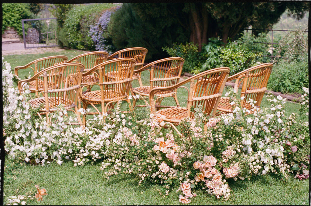 A Timeless Monteverdi Tuscany Wedding Garden-style wedding florals with peach and blush flowers at Monteverdi Tuscany ceremony