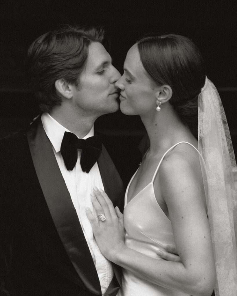 Bride and groom share a soft kiss at Monteverdi Tuscany, bride wearing Danielle Frankel gown and Jane Rhyan The Collection veil.